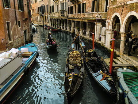 Clash between two Venetian gondolas in one of the most beautiful and characteristic canals of the whole city.のeditorial素材