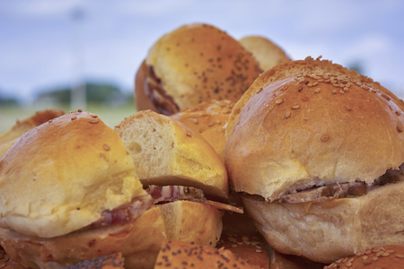 Detail of some sandwiches stuffed with pork on an outdoor dining.の写真素材
