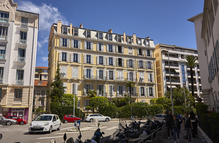 View of a colorful palace of Nice a city of unique and unmistakable architectural style: everyday life scene for the city.のeditorial素材
