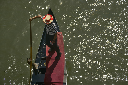 Gondolier who rests his Venetian gondola taken from above.の写真素材