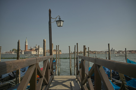 Small jetty or mooring for wooden gondola in Venice with views of the lagoonのeditorial素材