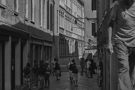 Black and white shot of a daily life scene in a typical Italian village.のeditorial素材
