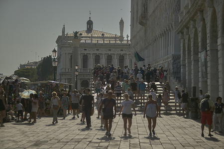 Venice's waterfront crowded with tourists on a beautiful summer dayのeditorial素材