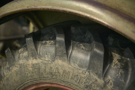 Detail of a tractor tire with its large notches to make adherence to the ground and difficult and disconnected ground.の写真素材