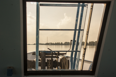 View of the river from the ferry window while sailing on the river itself.の写真素材