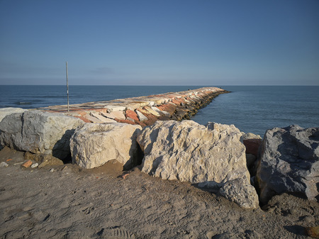 Wide angle view of a cliff on the sea at Rosolina Mare In Italyの写真素材