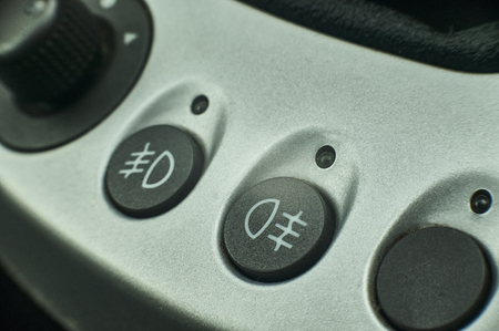 Buttons with warning lights of the fog lamps and headlights of a modern car.の写真素材