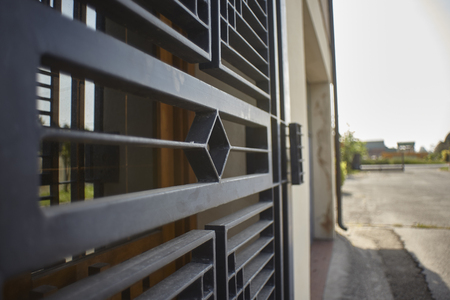 Armored door in artisan iron used for security reasons to protect a home.の写真素材
