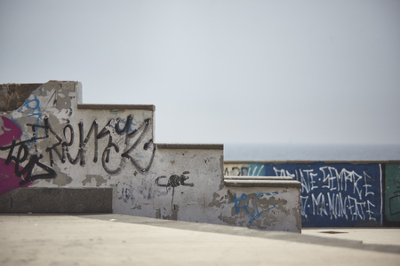 Step-by-step wall degraded and ruined by time and abandonment full of graffiti from local gangs.の写真素材