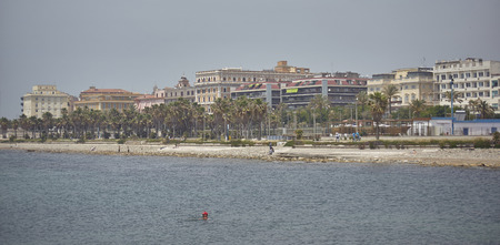 View of the beach and coast of the city of Civitavecchia in Italy.の写真素材