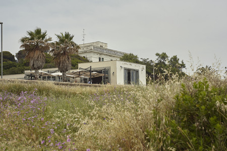 Small house on the seafront of civitavecchia with characteristic architectureの写真素材