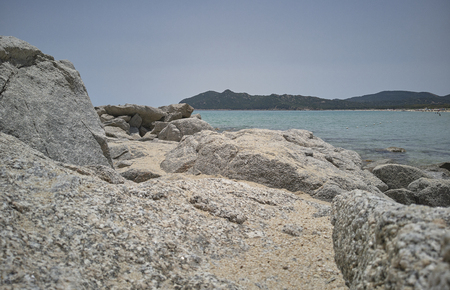Detail of stones and rocks that overlook the crystal clear sea below.の写真素材