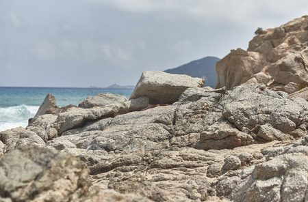 Detail of some rocks and rocks with the background sea taken during a sunny day.の写真素材