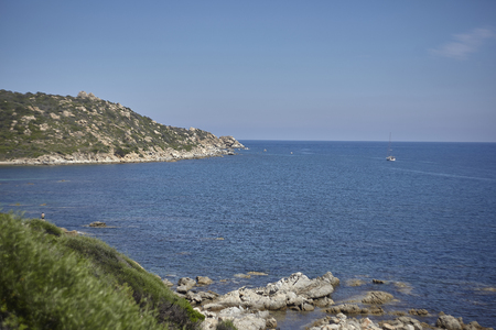 View of the Mediterranean sea surrounded by the indented coastline and rich in vegetation of the south of Sardinia.の写真素材