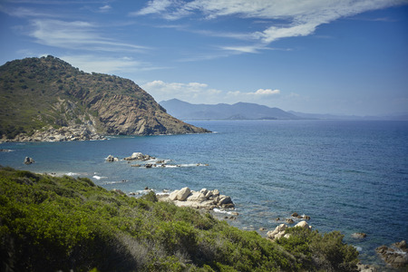 View of the Mediterranean sea surrounded by the indented coastline and rich in vegetation of the south of Sardinia.の写真素材