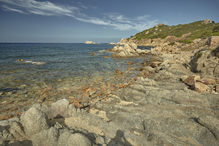 Rocky panorama of Cala Sa Figu beach in Sardinia: rocks and rocks meet the blue and crystalline sea.の写真素材