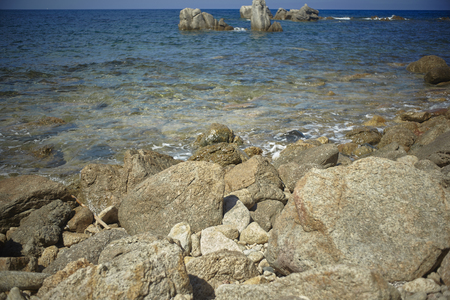 Rocks and rocks of southern Sardinia blend with the crystalline sea.の写真素材
