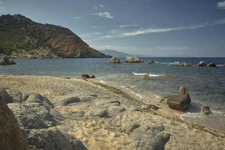 Beautiful Mediterranean beach typical of the coast of southern Sardinia taken over in summer.の写真素材