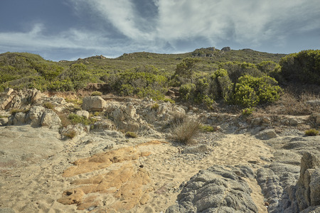 Desert landscape of some hills overlooking the Mediterranean in the south of Sardinia.の写真素材