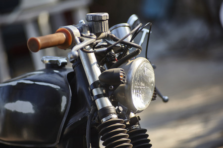 Simple detail of a handlebar belonging to an old motorcycle in a state of corrosion.の写真素材