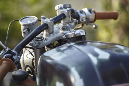Front view of the handlebars of an old rat style motorcycle with signs of corrosion and wear that have matured over time.の写真素材