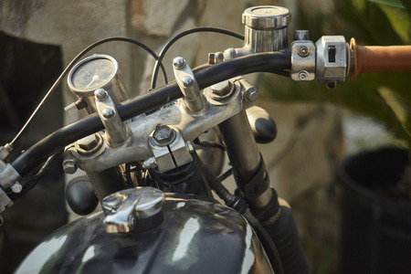 Simple detail of a handlebar belonging to an old motorcycle in a state of corrosion.の写真素材