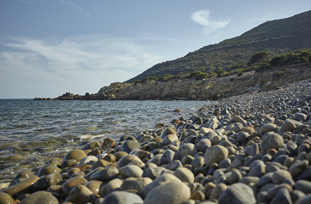 Magnificent view of Punta Molentis beach In Sardinia, taken during the summer: A completely uncontaminated and natural Mediterranean pebble beach.の写真素材