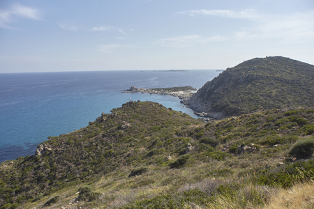 Aerial view of the panorama of a part of the coast of Sardinia overlooking the crystal clear sea on a summer day.の写真素材