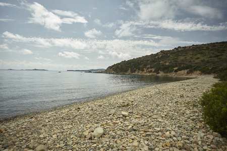 Natural beach made of pebbles in a natural bay nelsud of Sardinia.の写真素材