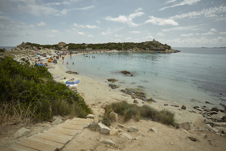 View of Punta Molentis beach in the south of Sardinia full of tourists during the summerの写真素材