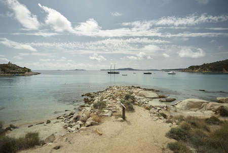 Seascape of the wonderful beach of Punta Molentis in the south of Sardinia: a view of the sea where boats moor near shore in a breathtaking natural setting.の写真素材