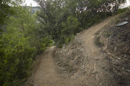 Small mountain path that allows climbers to overcome the difference in height of the mountain to reach the valley.の写真素材