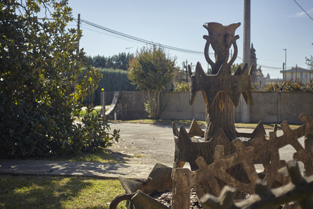 Garden with various decorations including a concrete fountain extinguished with sinuous shapes.の写真素材