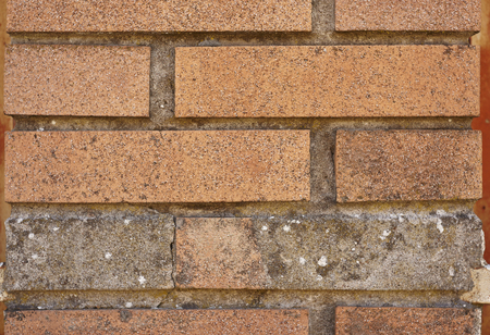 Texture of bricks in a wall usable as a background or graphic resource.の写真素材