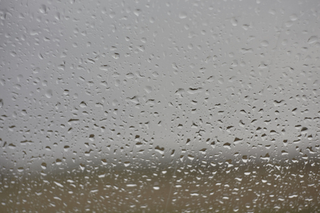 Raindrops glide on the window glass: raindrops on the glass.の写真素材