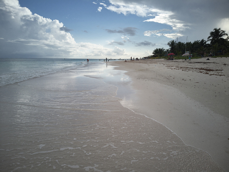 Beach of Xpu-Ha beach during sunset: Imagine where the transparent sea merges with the white beach colored by the warm tones of the dim light at sunset.の写真素材