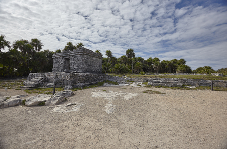 Side view of the remains of a small Mayan temple in the Tulum complex in Mexicoの写真素材