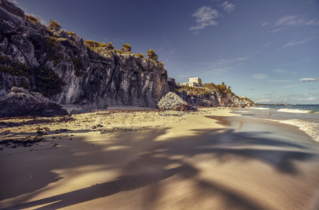 View of the beach of the Tulum archaeological site in Mexico during sunset.の写真素材