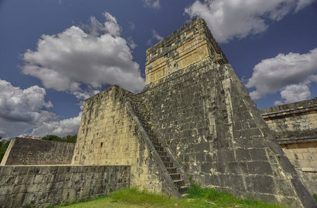Side-rear view of the Temple of the Jaguar in the archaeological complex of Chichen Itza in Mexico