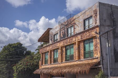 Beautiful building colored and artistically painted in the heart of the town of Tulum in Mexicoのeditorial素材