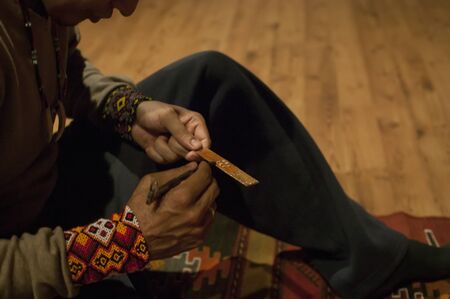 Detail of the shaman's hands as he prepares the KambÃ²: a substance extracted from the glands of a South American frog for its shamanic ceremonyのeditorial素材
