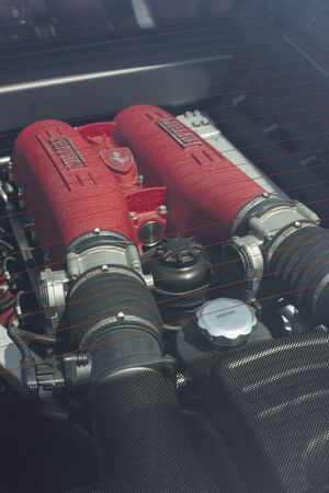 Detail of the engine, in particular the intake system, of a Ferrari, the sports car par excellence.のeditorial素材