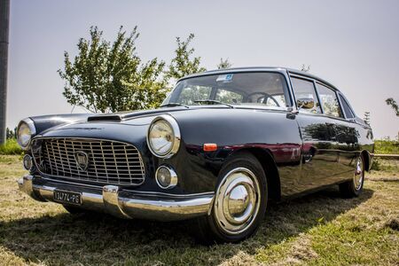 An old vintage blue Lancia displayed at a vintage car show.のeditorial素材
