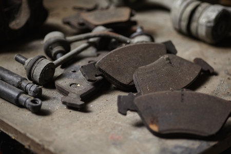 Accumulation of old used and worn spare parts for cars in the warehouse of a mechanical workshop.の写真素材