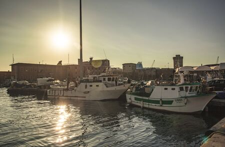 Detail of some boats moored in the port of Livorno during sunsetのeditorial素材