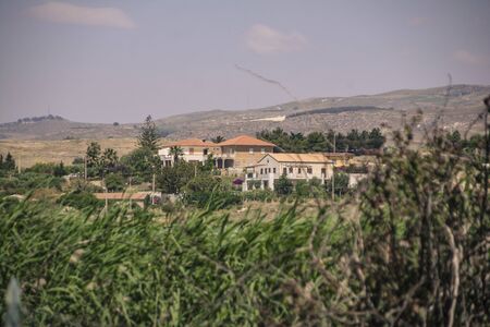 Casolare Immersed in the hilly Sicilian rural panorama during the summer periosa in Marina di Buteraの写真素材