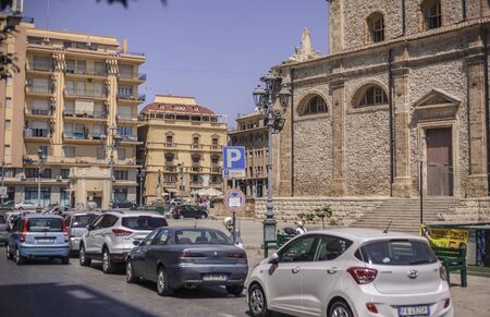 View of a street in the village of Gela with its daytime life in the south of Sicily in Italy.の写真素材