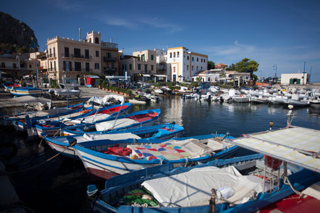View of Mondello where you can see sea boats and the whole panorama in the background.