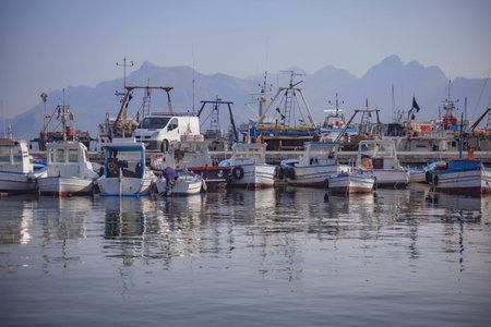 Boats moored at sunset in Porticello, Sicily