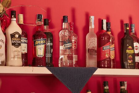 Liquor bottles in the bar counterの写真素材